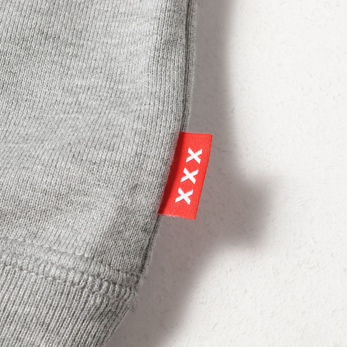 Xプリント柄 スウェット パーカー