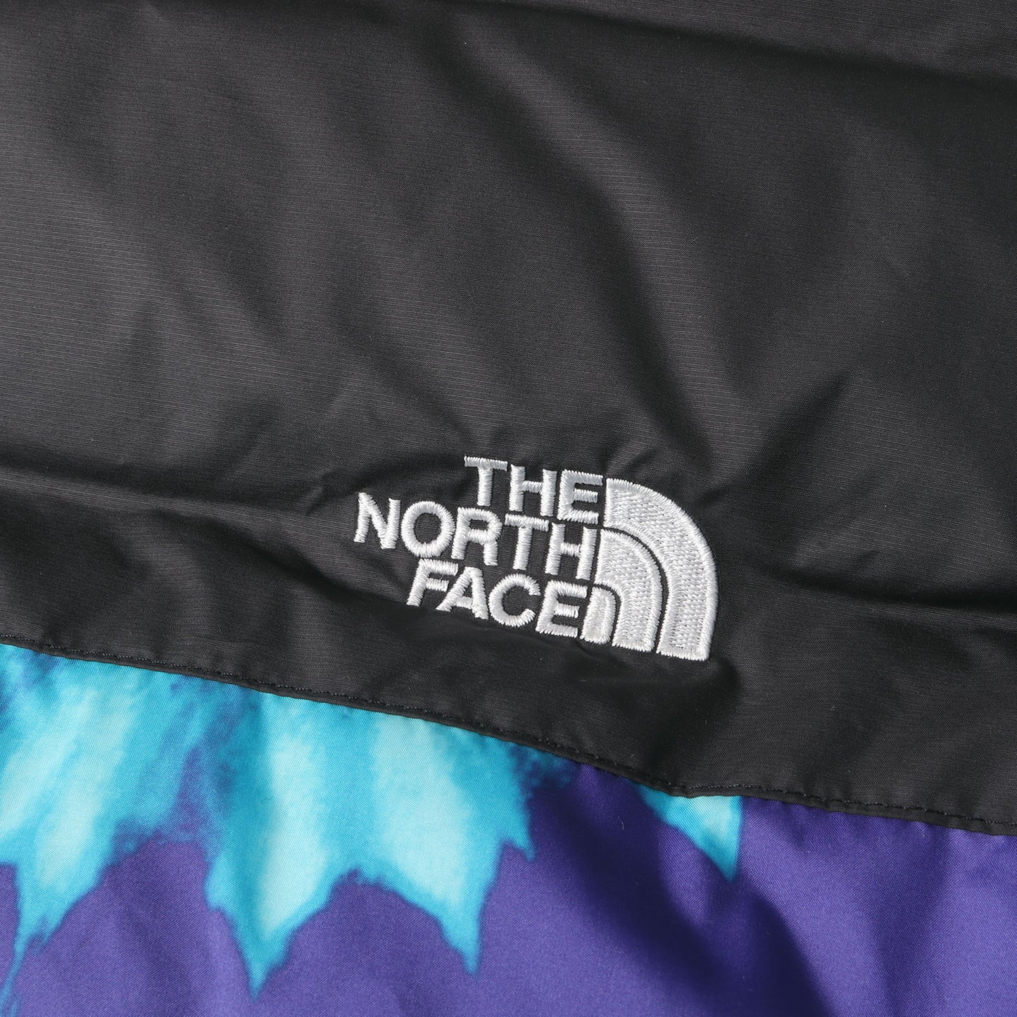 ×SNS Sneakersnstuff タイダイ柄 ヌプシ ダウンジャケット(NUPTSE JACKET)
