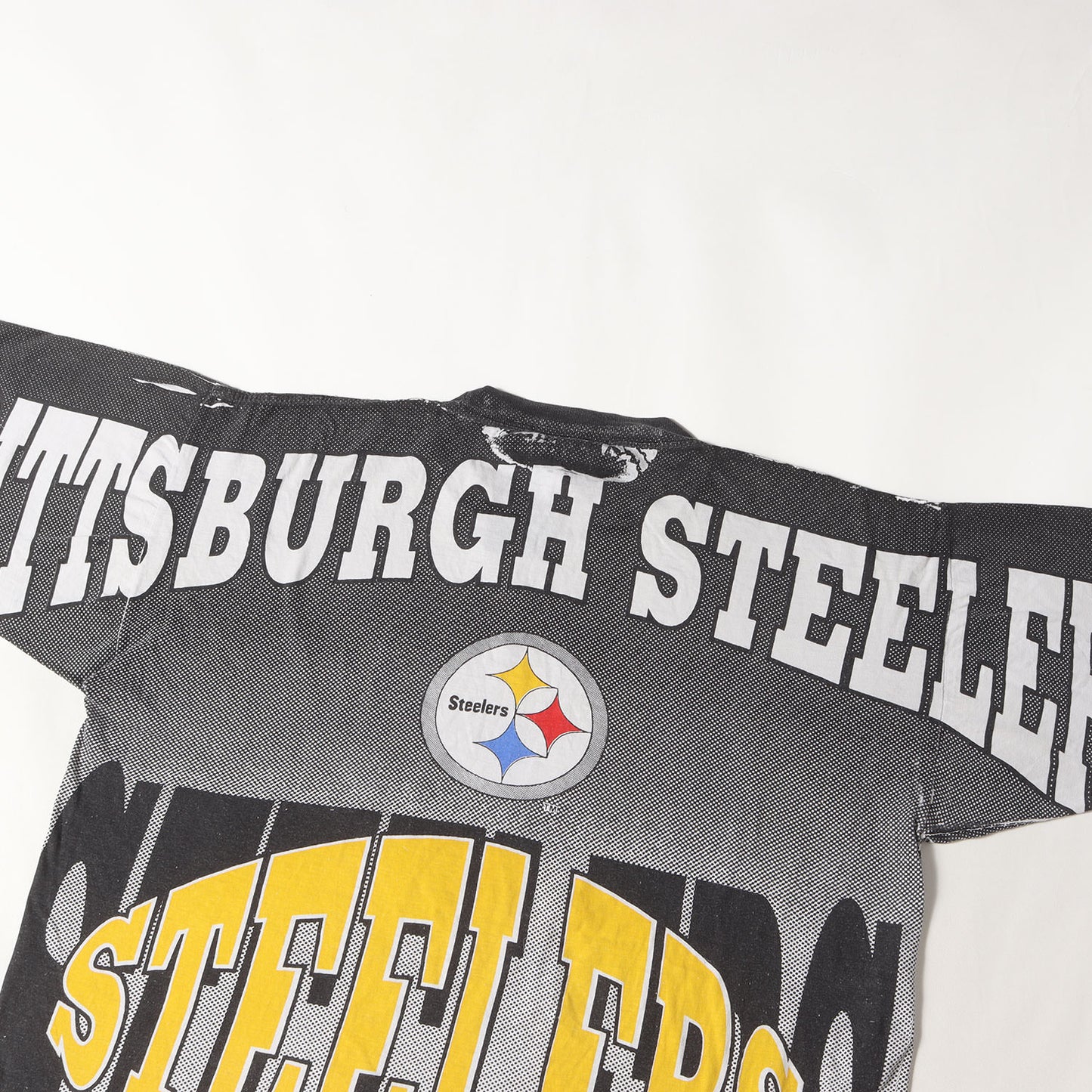 90s NFL ピッツバーグ・スティーラーズ 全面プリント Tシャツ(AMERICAS FAVORITESボディ)