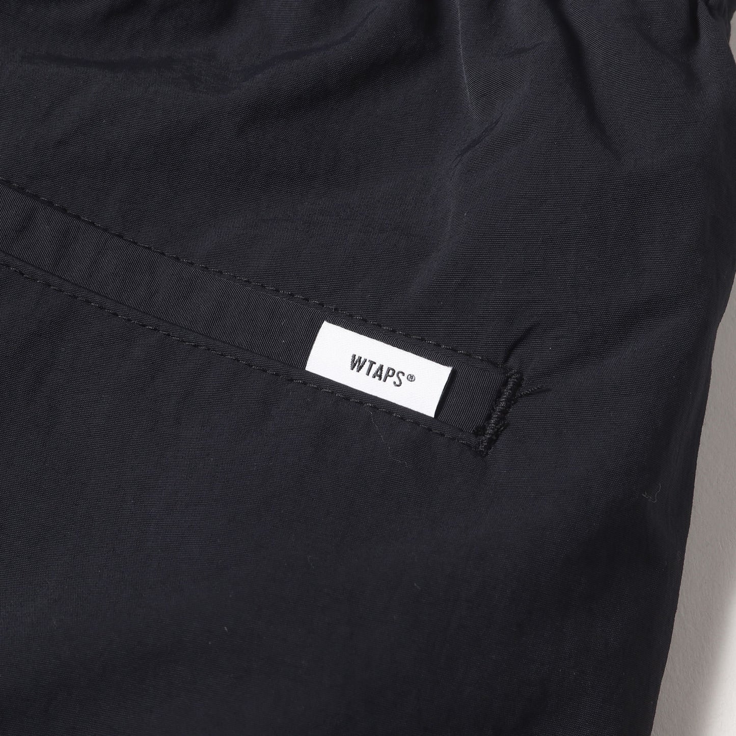 24AW ブランドロゴ刺繍 ナイロン トラックパンツ(SPST2002 /TROUSERS / NYLON. TUSSAH)