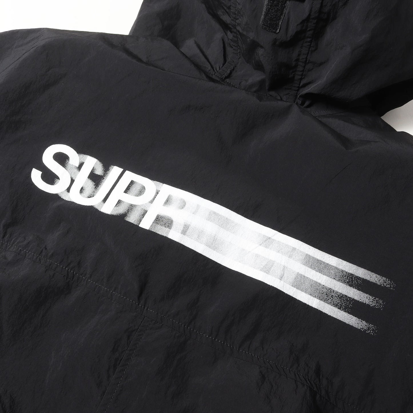 23SS モーションロゴ パッカブル ナイロン コート(Motion Logo Lightweight Parka)
