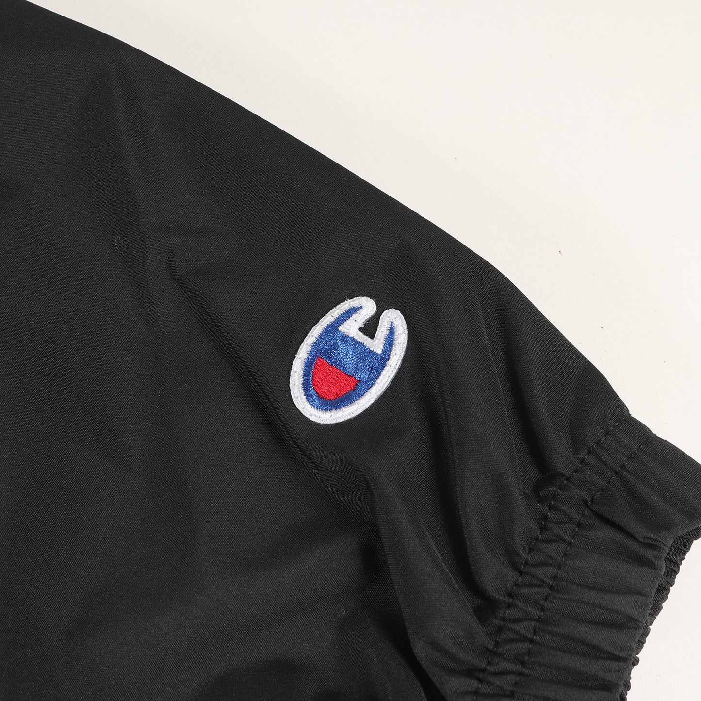 24AW × Champion ロゴ プリント アノラック パーカー (Packable Anorak)