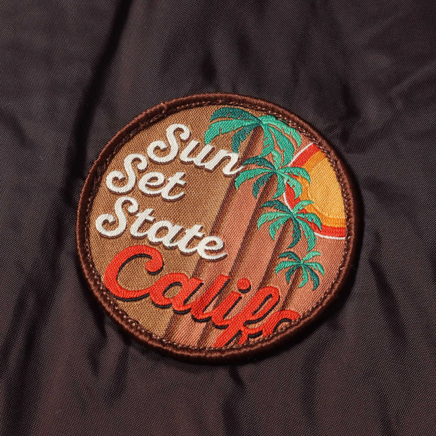 ワッペン付き ナイロン コーチジャケット(CoAch Jacket Sun Set State)