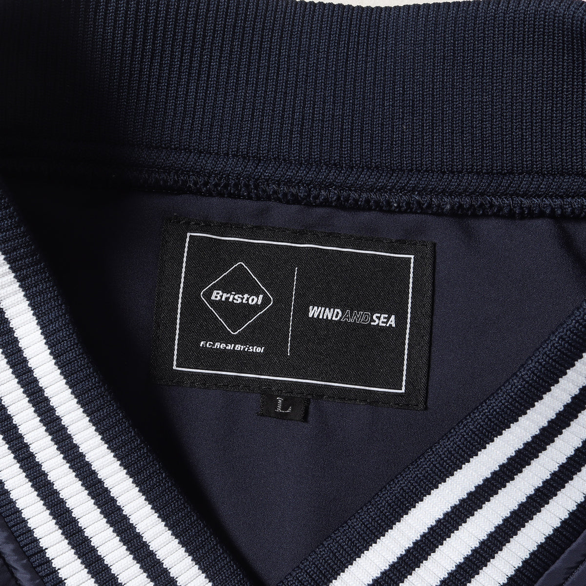 22SS ×WIND AND SEA ナイロン プルオーバー ピステ(BRISTOL SEA NYLON V-NECK PISTE)