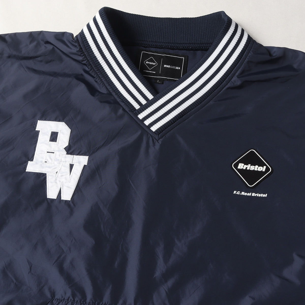 22SS ×WIND AND SEA ナイロン プルオーバー ピステ(BRISTOL SEA NYLON V-NECK PISTE)