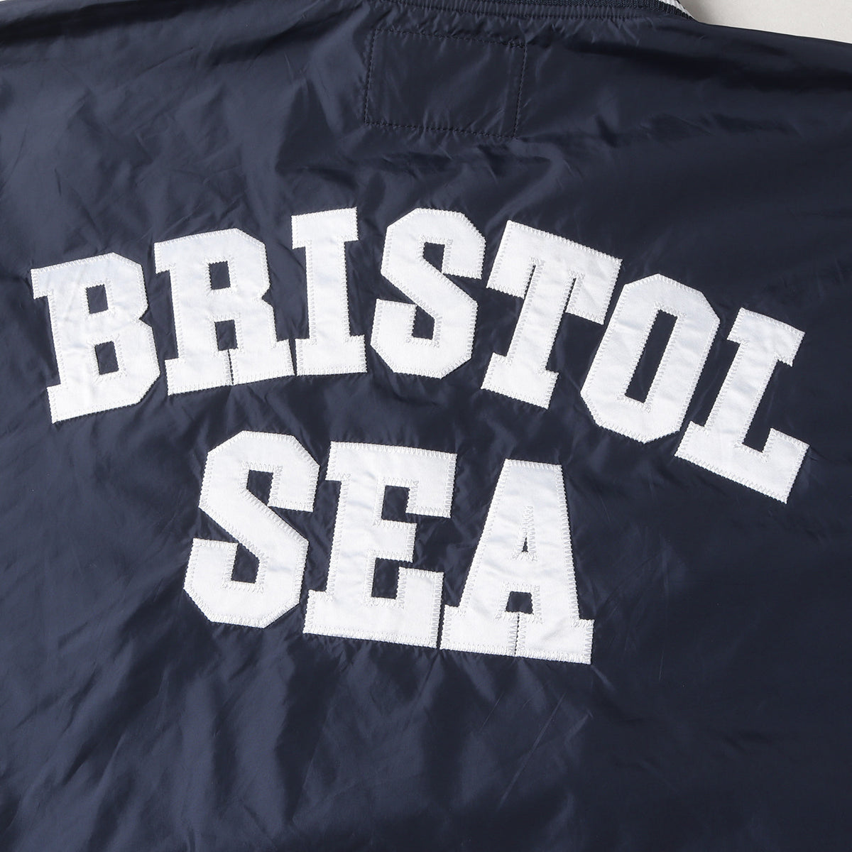 22SS ×WIND AND SEA ナイロン プルオーバー ピステ(BRISTOL SEA NYLON V-NECK PISTE)