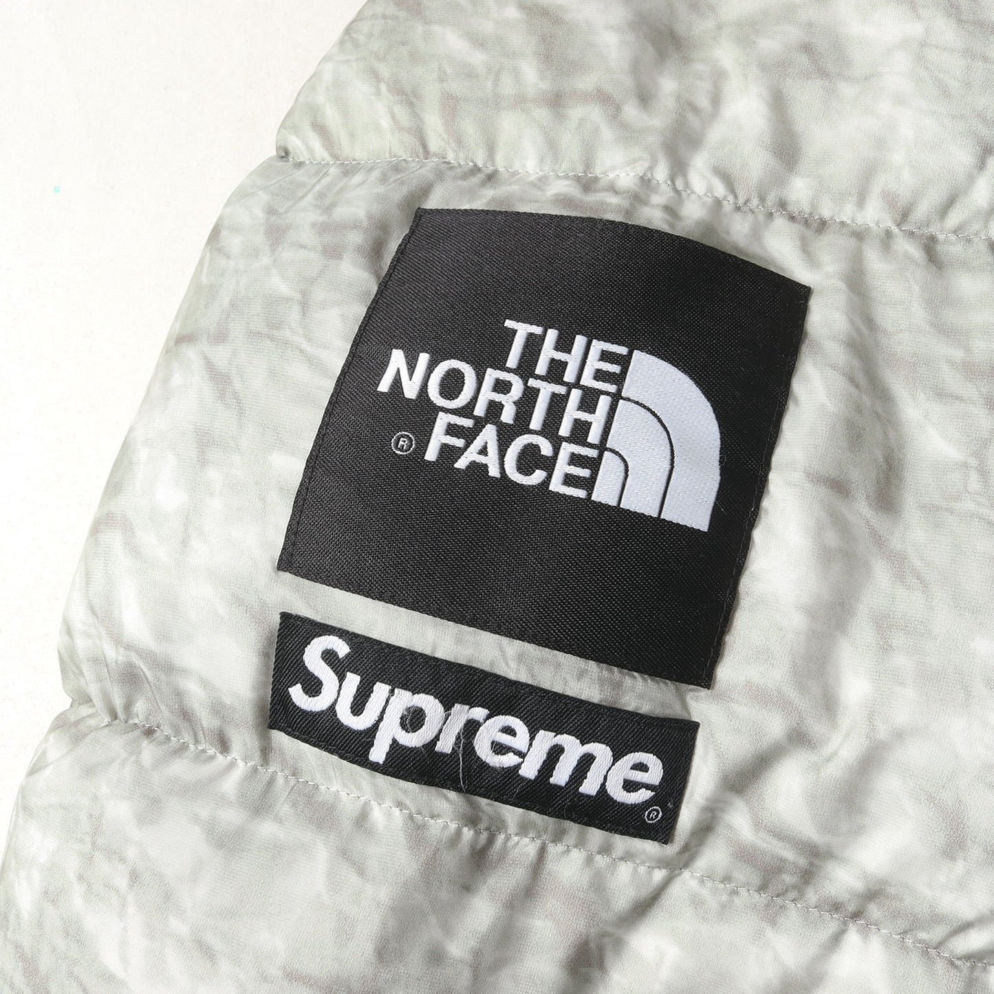 ×THE NORTH FACE ペーパープリント ヌプシ ダウンジャケット(Paper Print Nuptse Jacket)