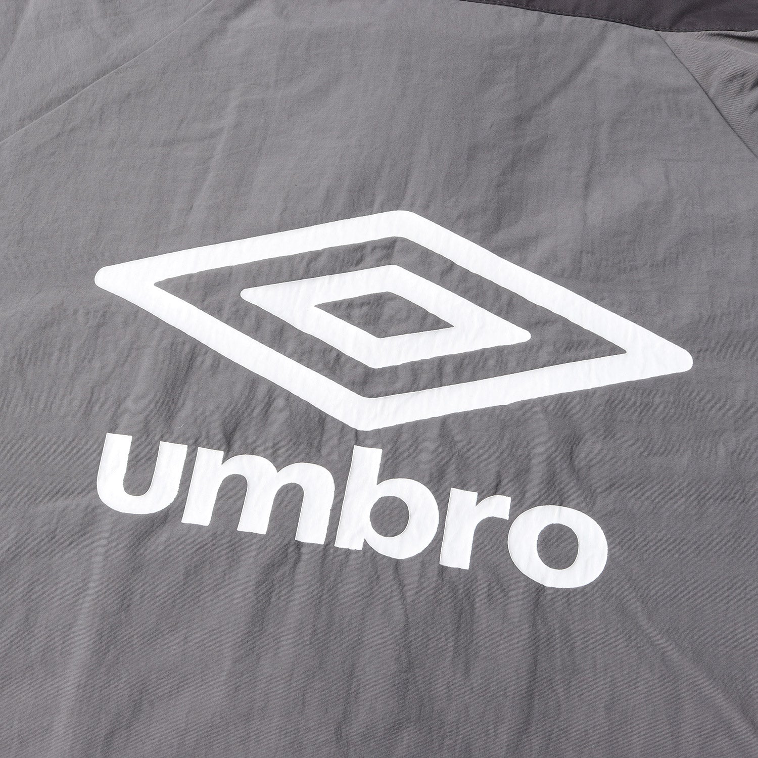 9090 (ナインティーナインティー) ×UMBRO ナイロン トラック