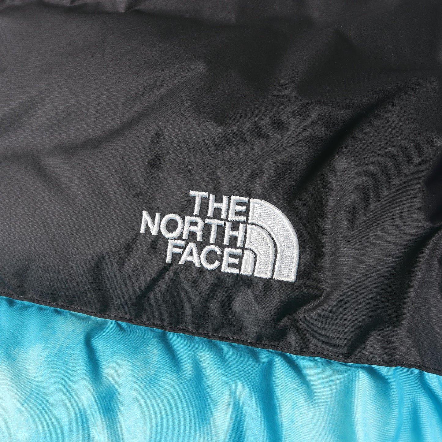 ×SNS Sneakersnstuff タイダイ柄 ヌプシ ダウンジャケット(NUPTSE JACKET)