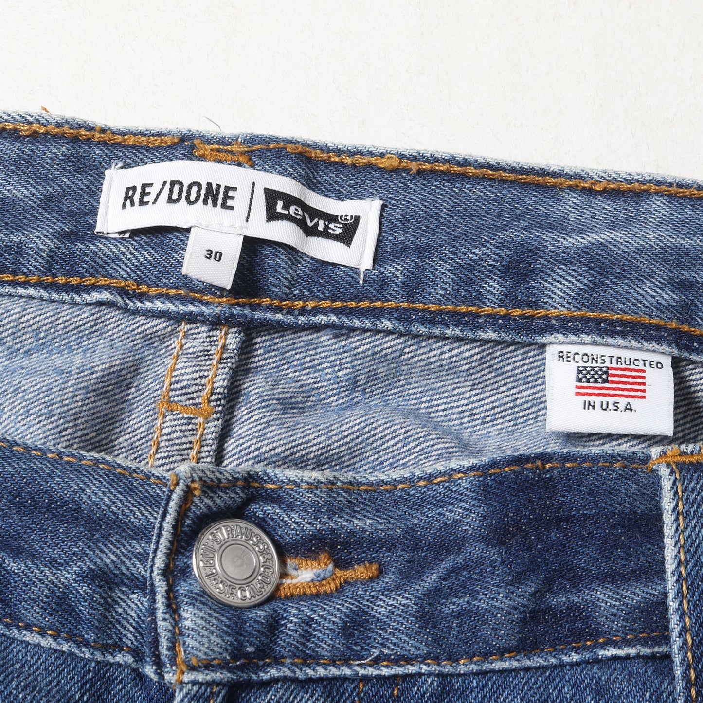 ×Levi's 古着リメイク スリム テーパード デニムパンツ