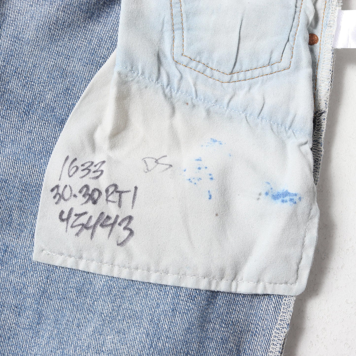 ×Levi's 古着リメイク スリム テーパード デニムパンツ