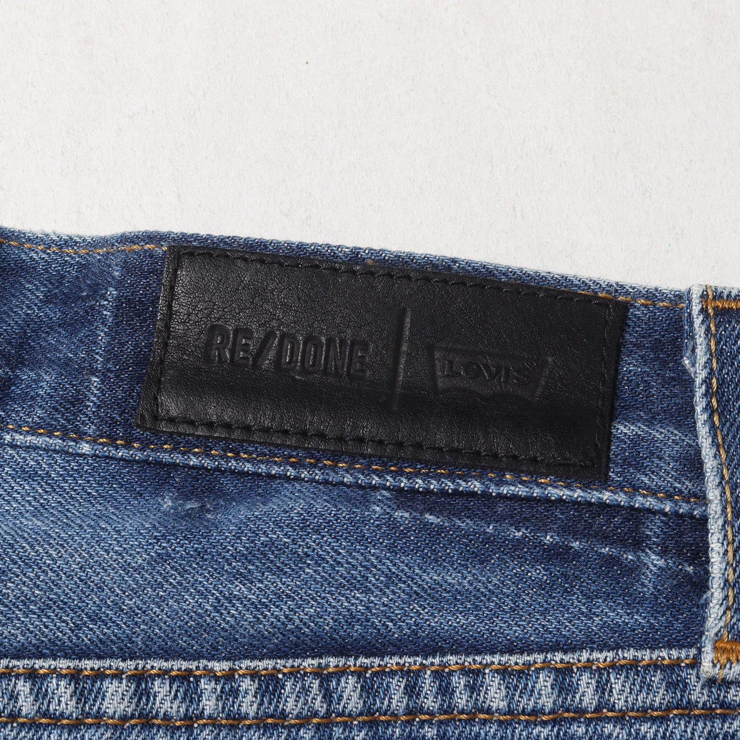 ×Levi's 古着リメイク スリム テーパード デニムパンツ