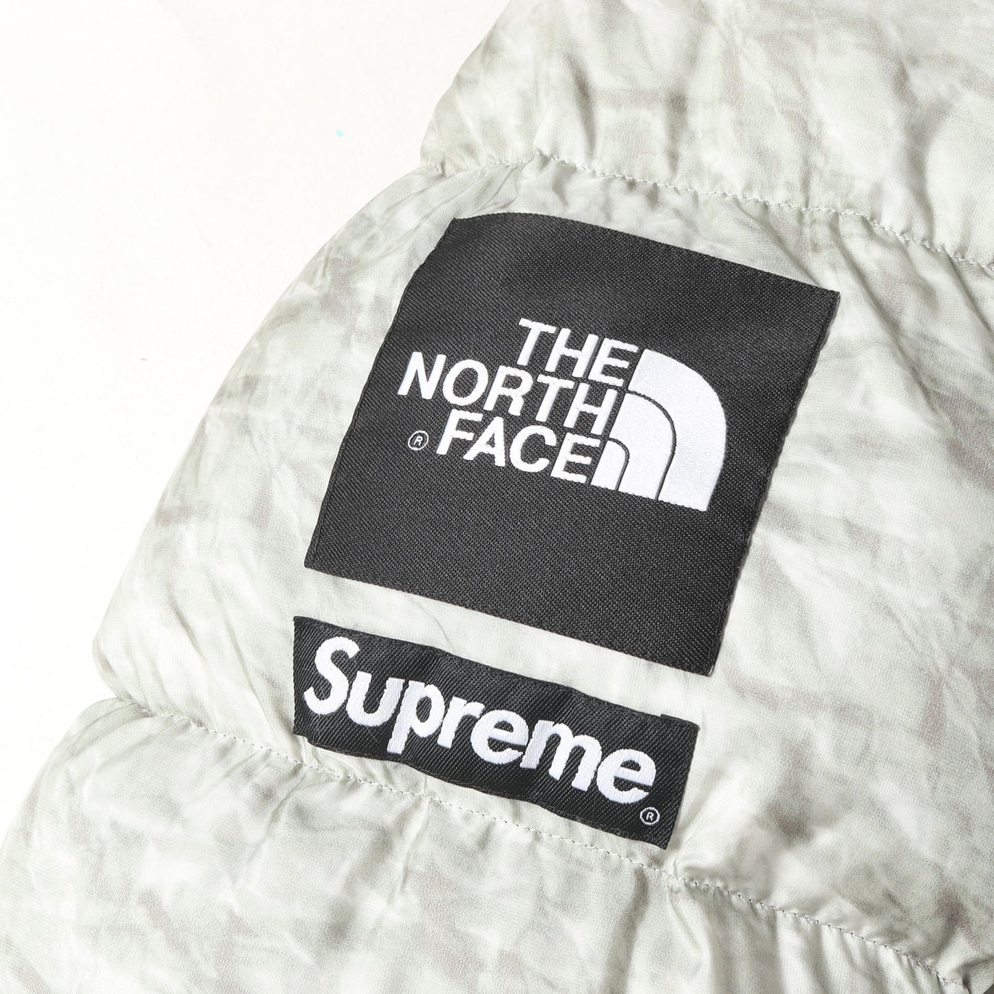 ×THE NORTH FACE ペーパープリント ヌプシ ダウンジャケット(Paper Print Nuptse Jacket)