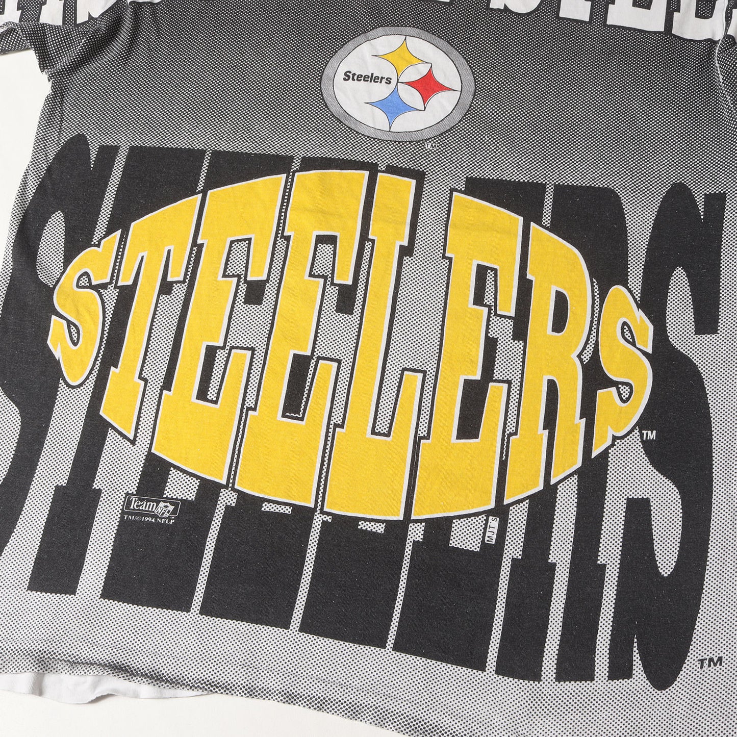 90s NFL ピッツバーグ・スティーラーズ 全面プリント Tシャツ(AMERICAS FAVORITESボディ)