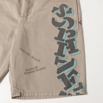 25SS ×SIMON TAYLOR グラフィック チノショーツ(LOGO CHINO SHORTS)