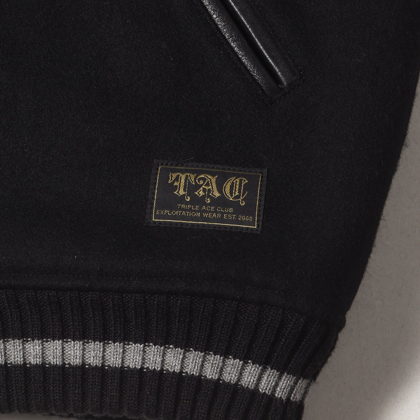 クロスロゴ 袖レザー メルトン スタジャン