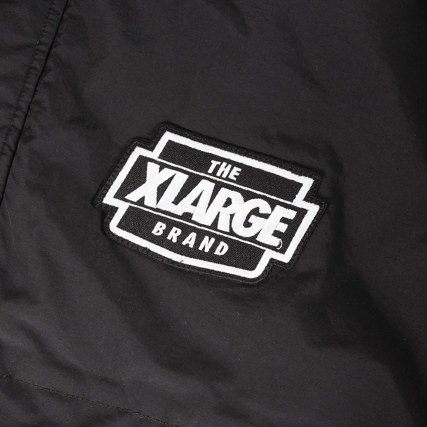 23AW アーチロゴ 裏地キルティング ナイロン ジャケット(NYLON PUFFER JACKET)