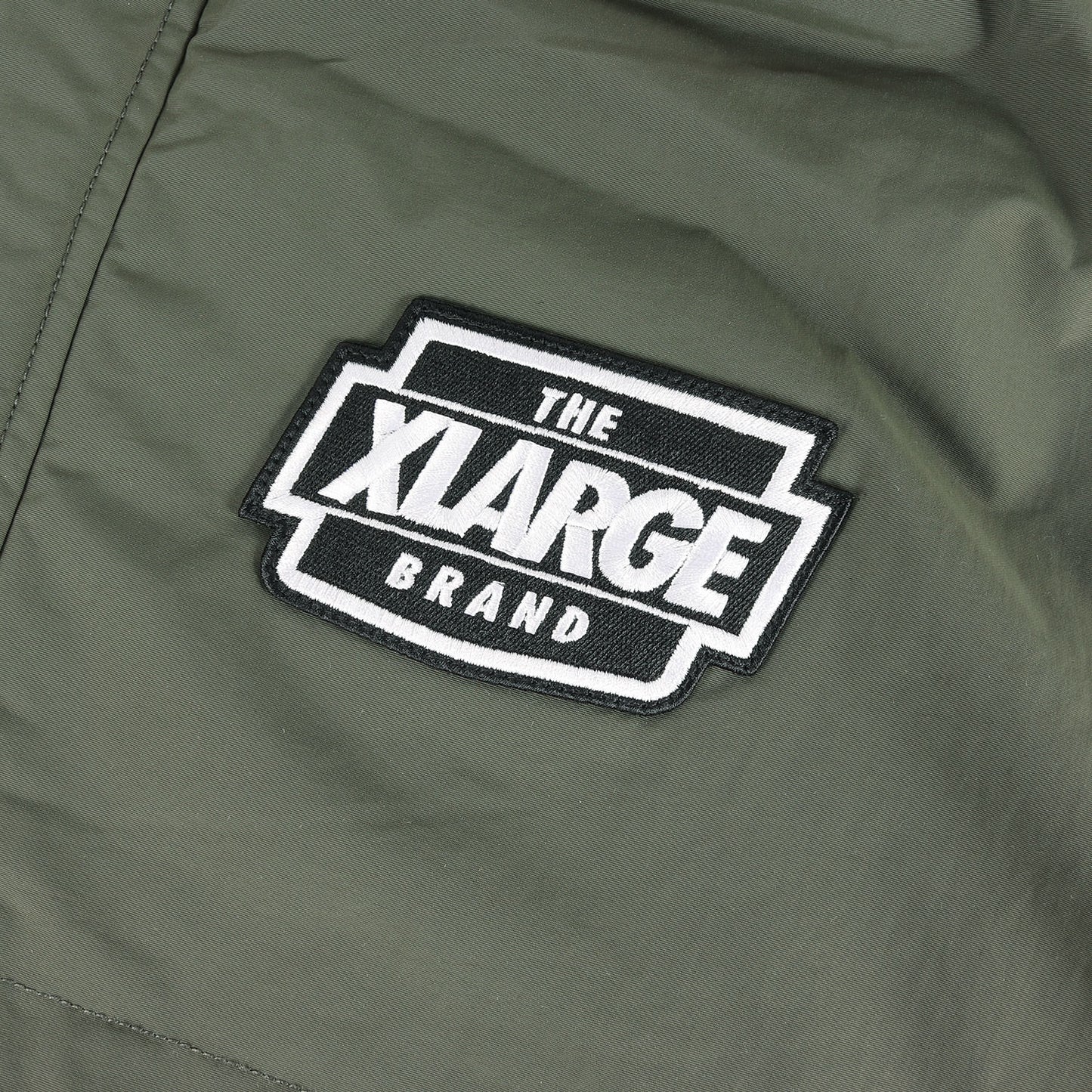 23AW アーチロゴ 裏地キルティング ナイロン ジャケット(NYLON PUFFER JACKET)