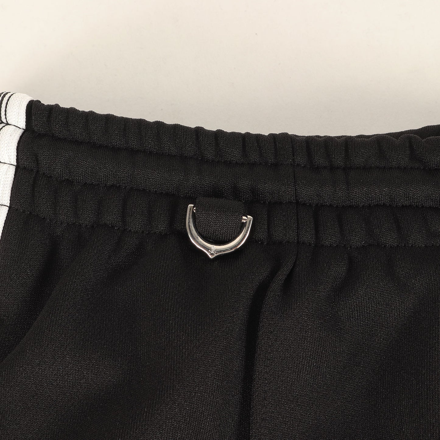 25AW ×MASTERMIND WORLD サイドテープ ジャージ トラックパンツ