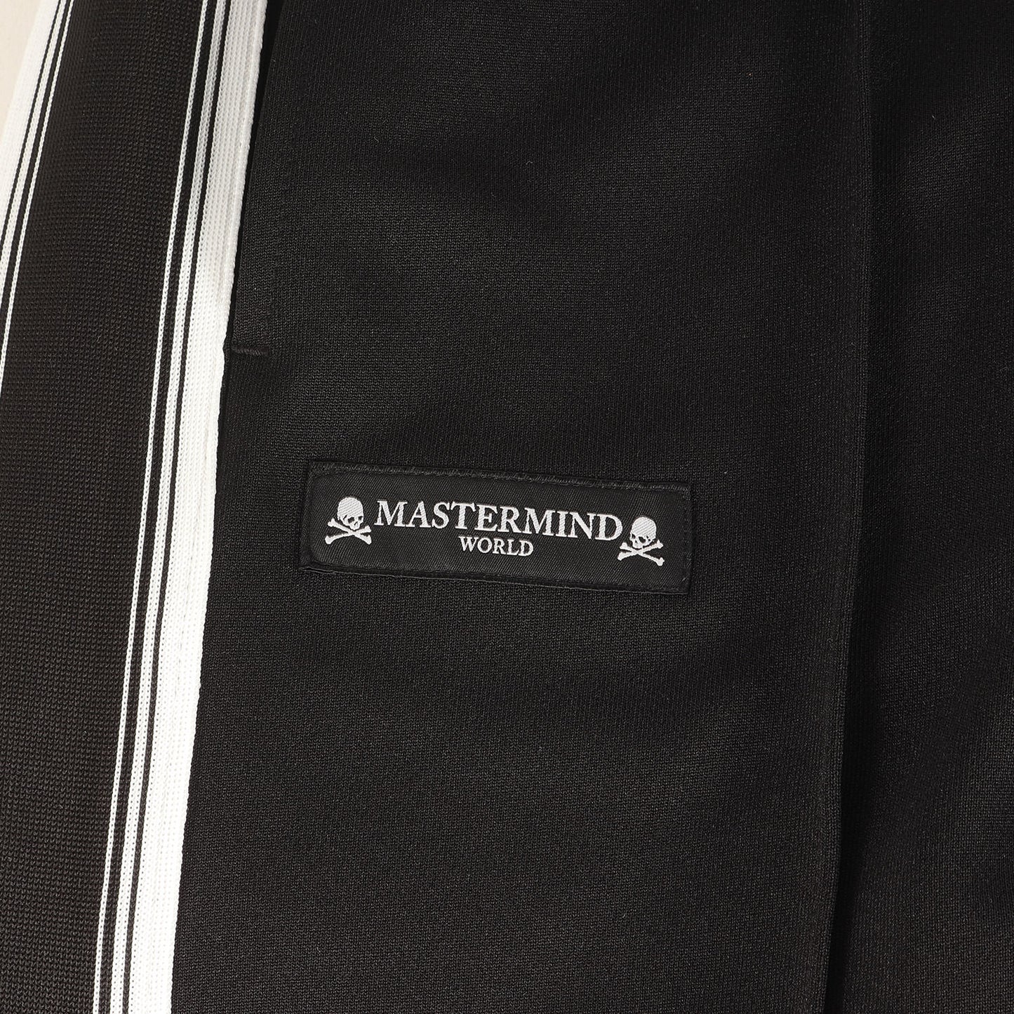 25AW ×MASTERMIND WORLD サイドテープ ジャージ トラックパンツ