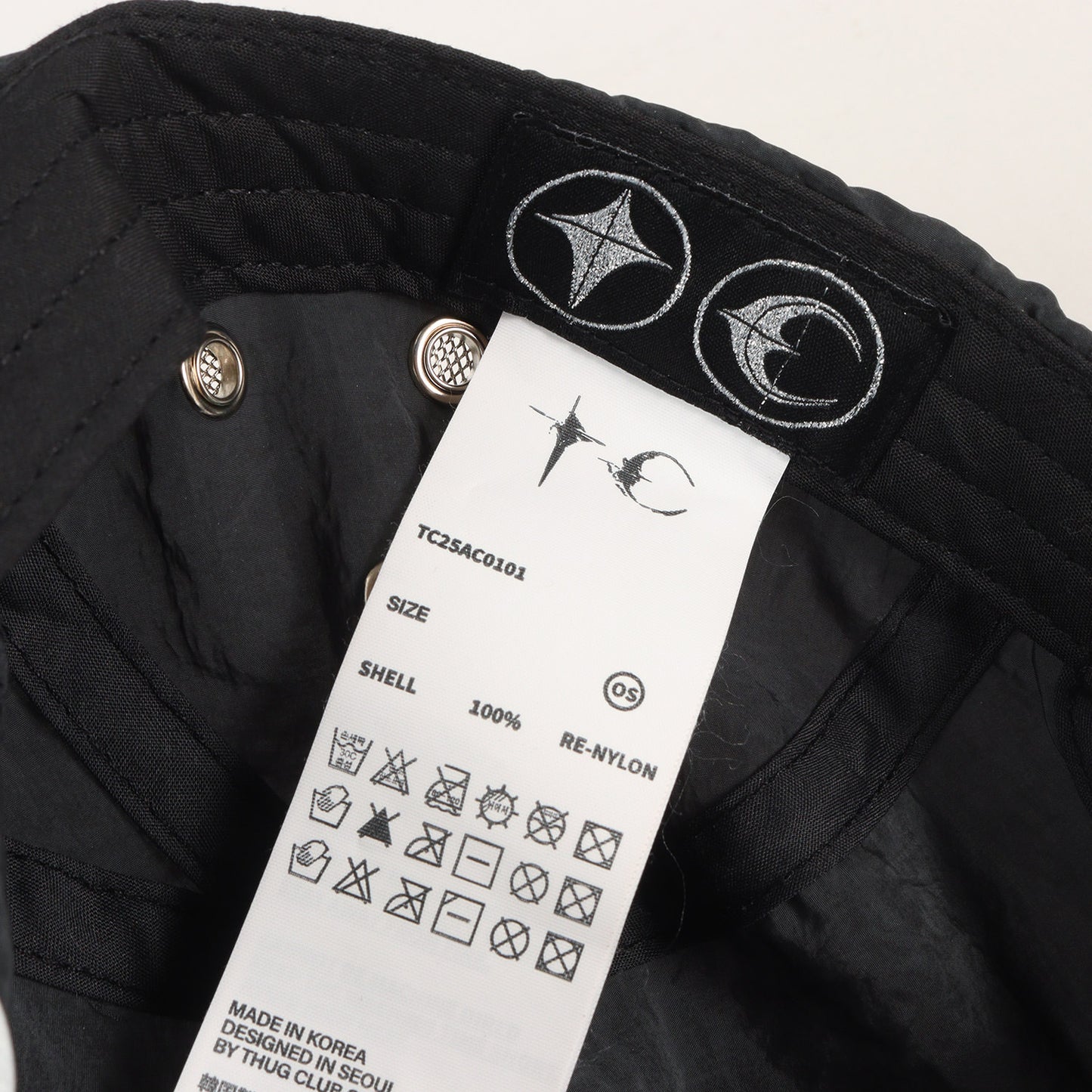 25SS ロゴプレート付き ナイロンキャップ(Scarred Bio Army Cap)