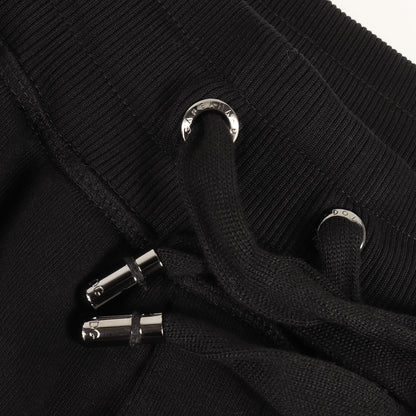 23AW ロゴプレート付き テーパード スウェットパンツ