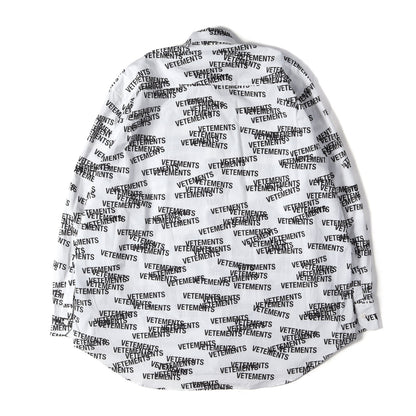 オールオーバー スタンプロゴ オーバーサイズ コットン 比翼ボタン シャツ (All-over Stamp Logo Oversized Shirt)
