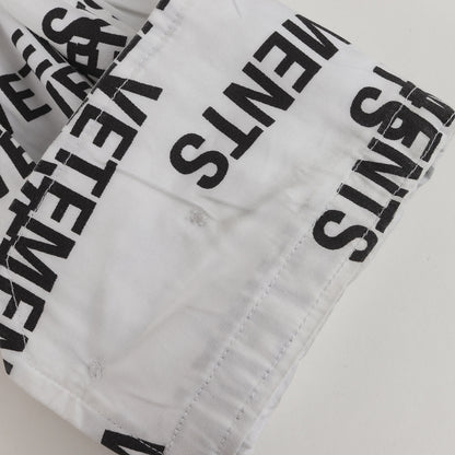 オールオーバー スタンプロゴ オーバーサイズ コットン 比翼ボタン シャツ (All-over Stamp Logo Oversized Shirt)