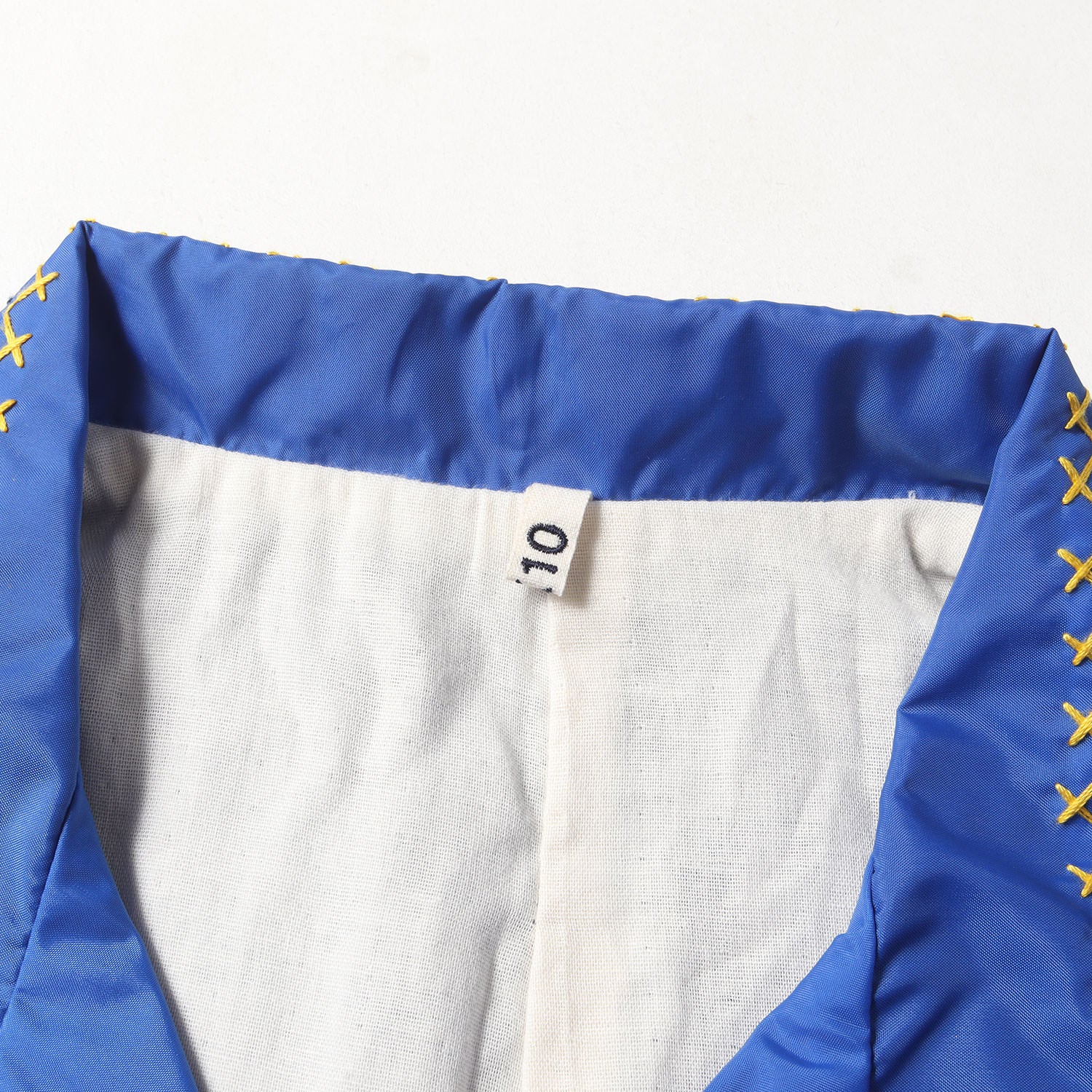 KHOKI (コッキ) 24SS フランネルライニング クロスステッチ ナイロン