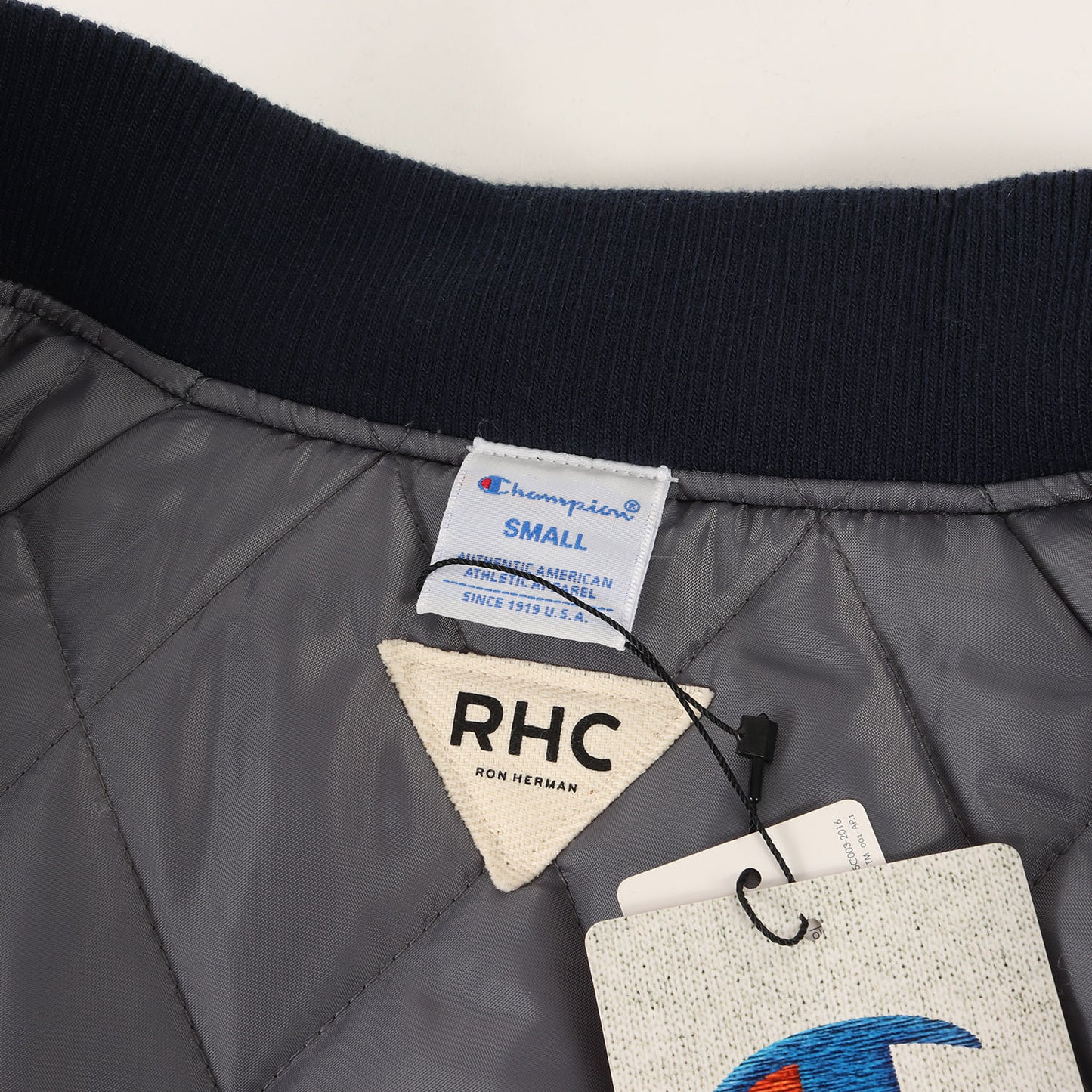 × Champion ナイロン パテッド スタジャン (C8-L649) / RHC