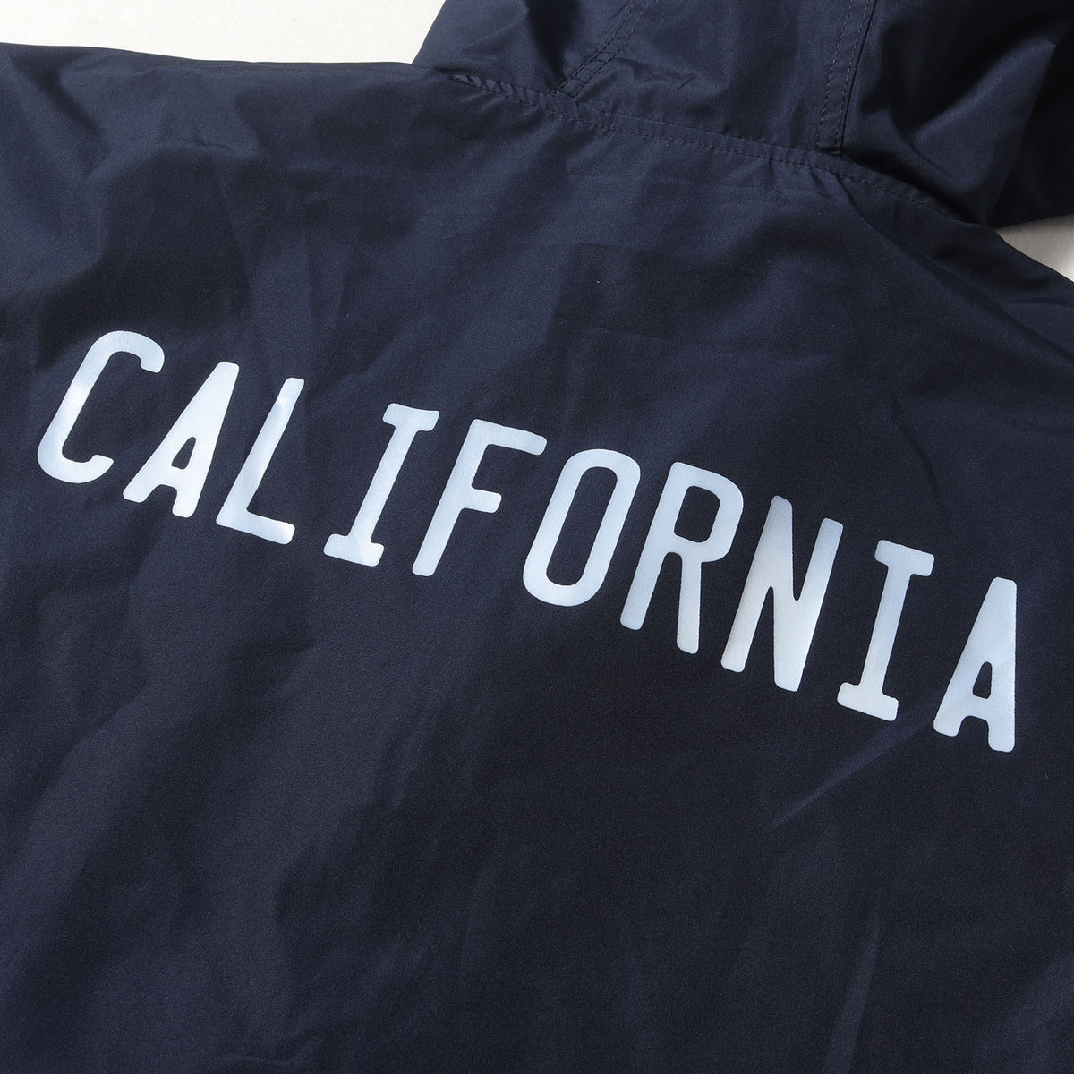 24AW × Champion ロゴ プリント アノラック パーカー (Packable Anorak)