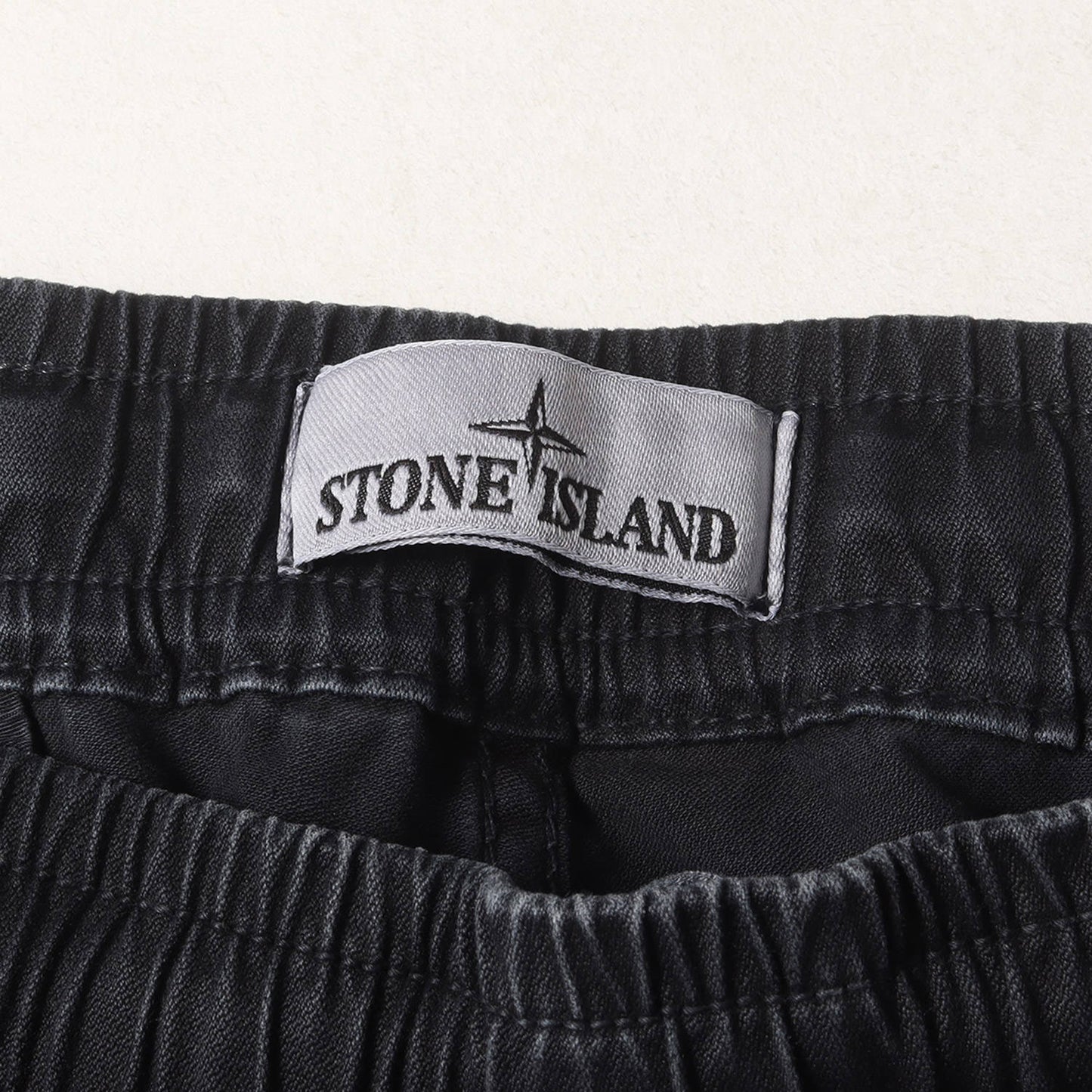 23AW コンパスパッチ ガーメントダイ加工 ストレッチ テーパード カーゴパンツ (COMPASS PATCH LOGO CARGO TROUSERS 7915313L1)