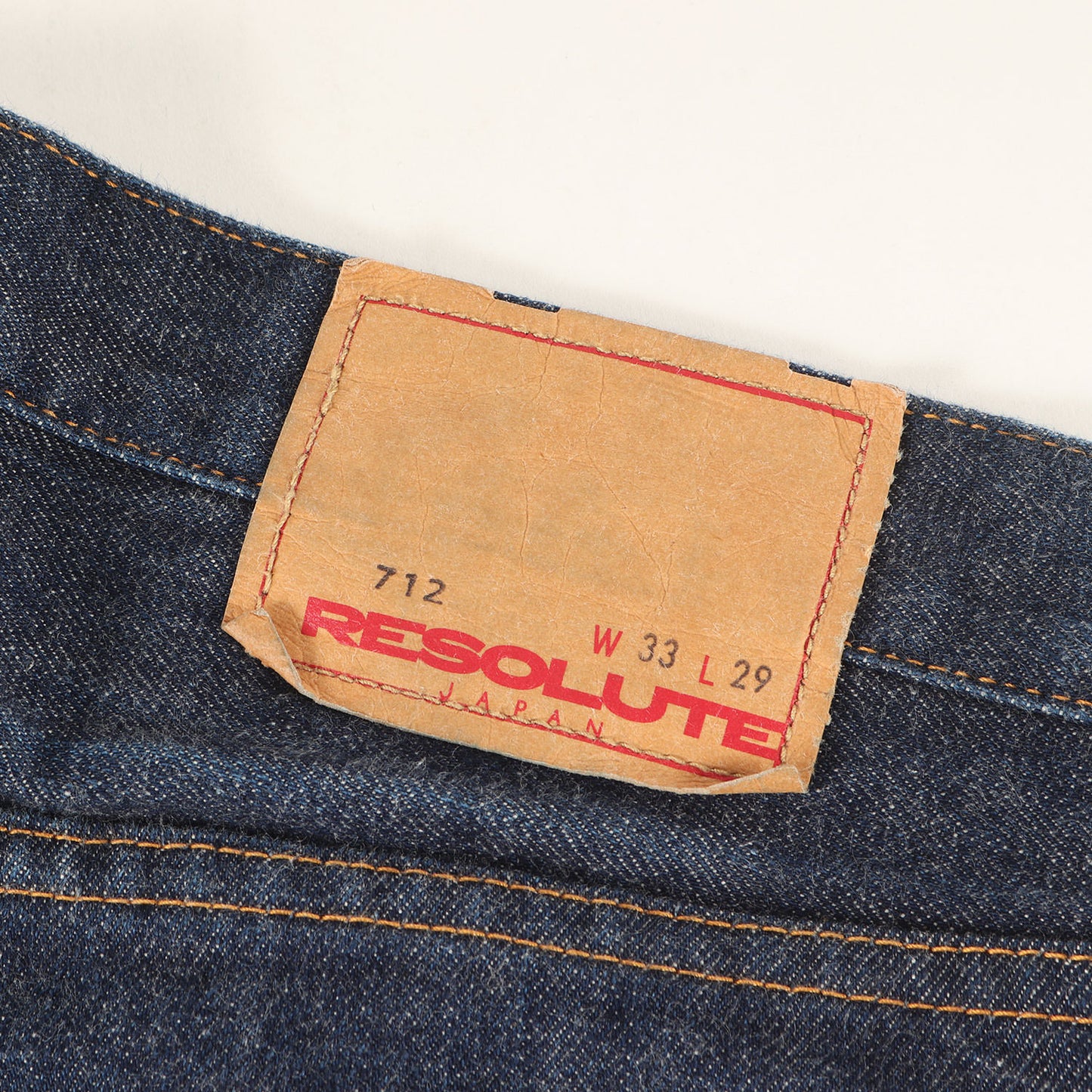 712 テーパード デニムパンツ