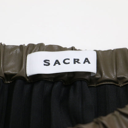 24秋冬 シンセティックレザー プリーツスカート / SYNTHETIC LEATHER PLEATS SKIRT ロング丈 ランダムヘムライン